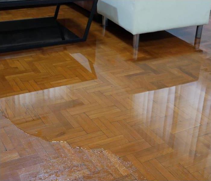 interior wood floor partially submerged in water